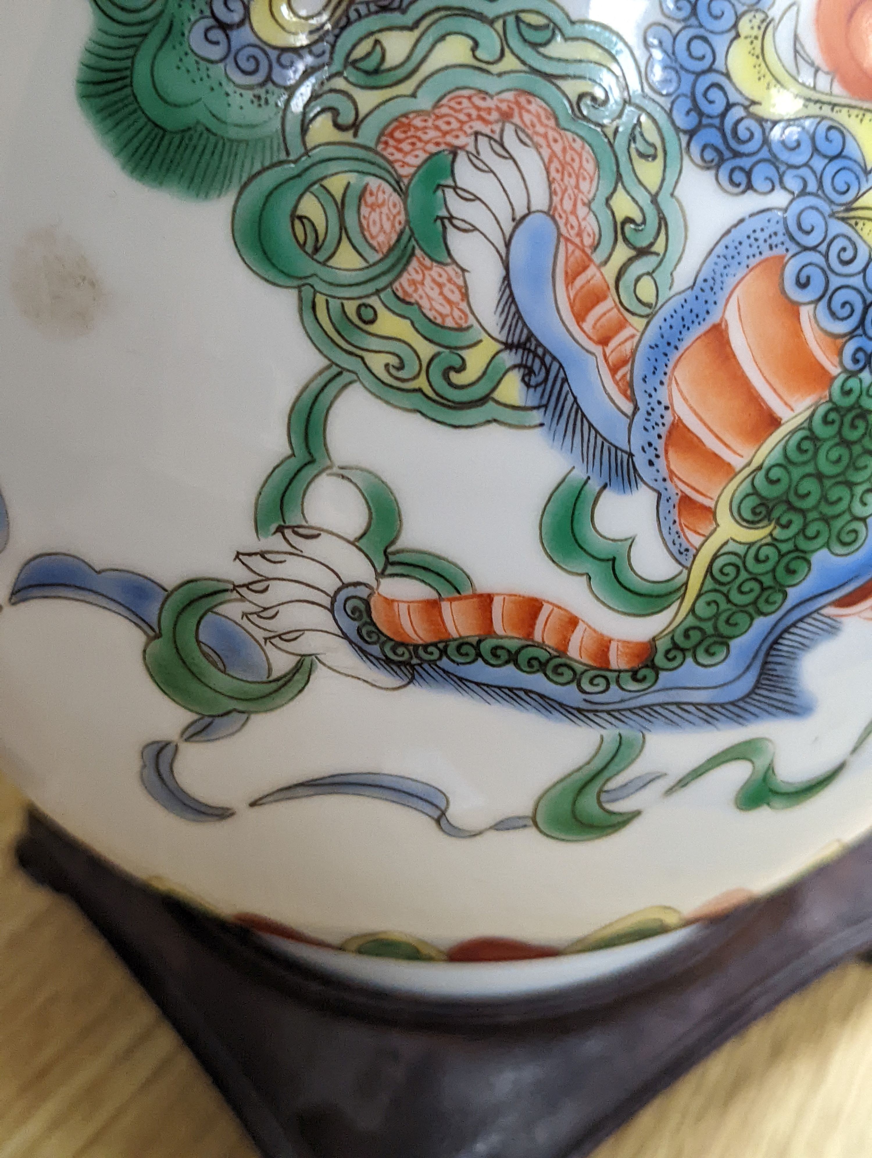 A Chinese famille verte pear shaped ‘Buddhist lion’ vase, on stand, 32 cms high not including stand.